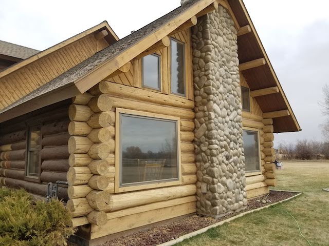 one wall blasted of log home